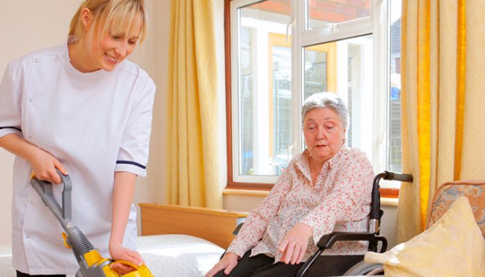 young-Nurse-cleaning-for-senior-woman-in-a-care-home1
